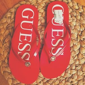 GUESS red flip flops